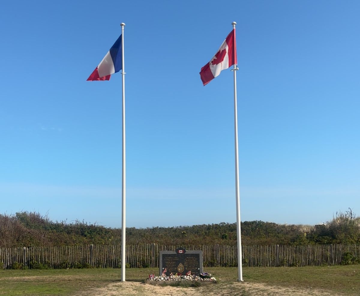 French and Canadian flags at a Canadian memorial on Juno Beach